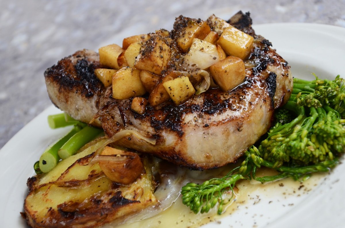 Bone-in pork chop with roasted apple